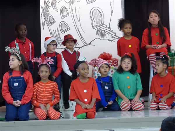Sawyer Road drama club students in Who-villian costumes during a performance of How the Grinch Stole Christmas